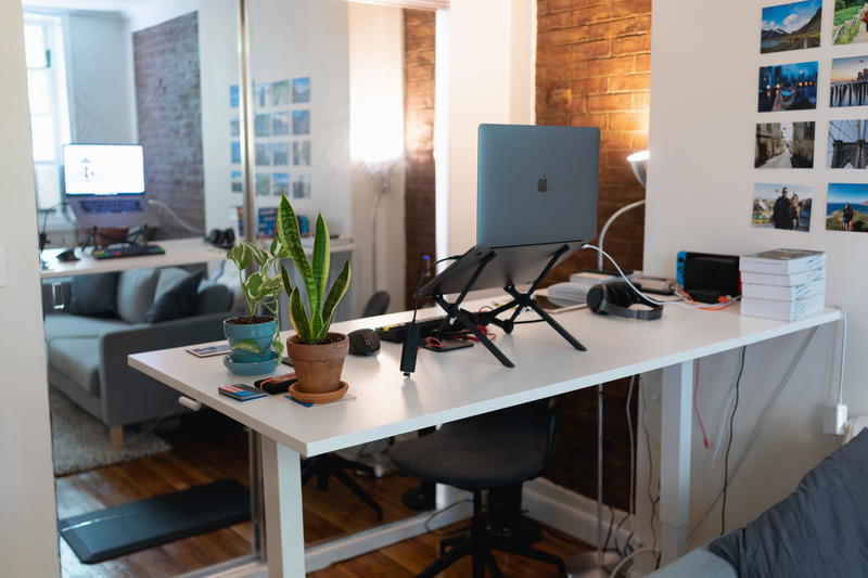 A white desk in a living room.