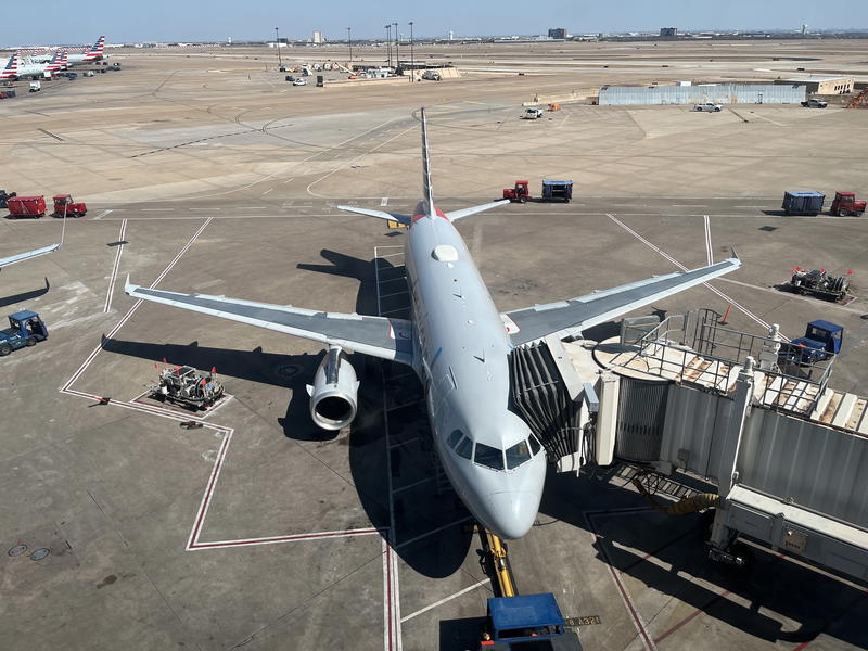 A plane is parked on the tarmac.