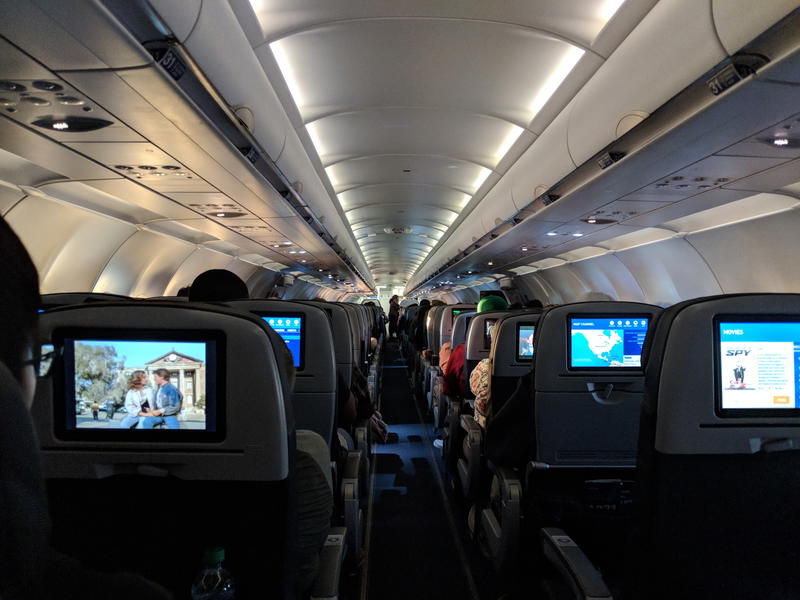 A plane with a lot of people in it.