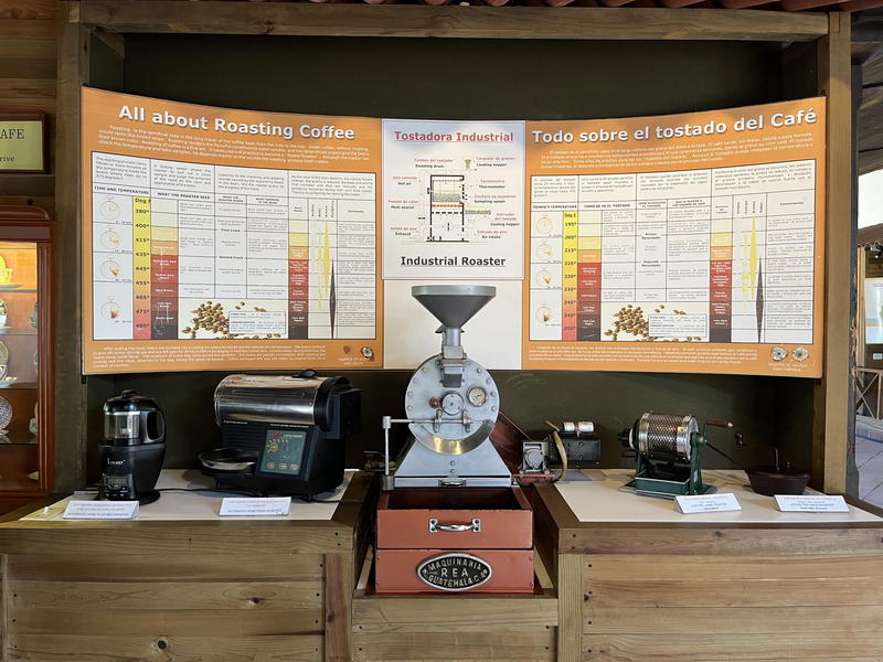 A display of a Guatemalan coffee machine and a poster.