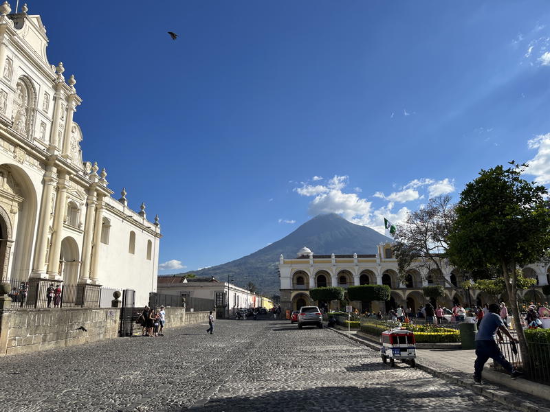 Antigua, Guatemala: A city with a church and a volcano in the background.