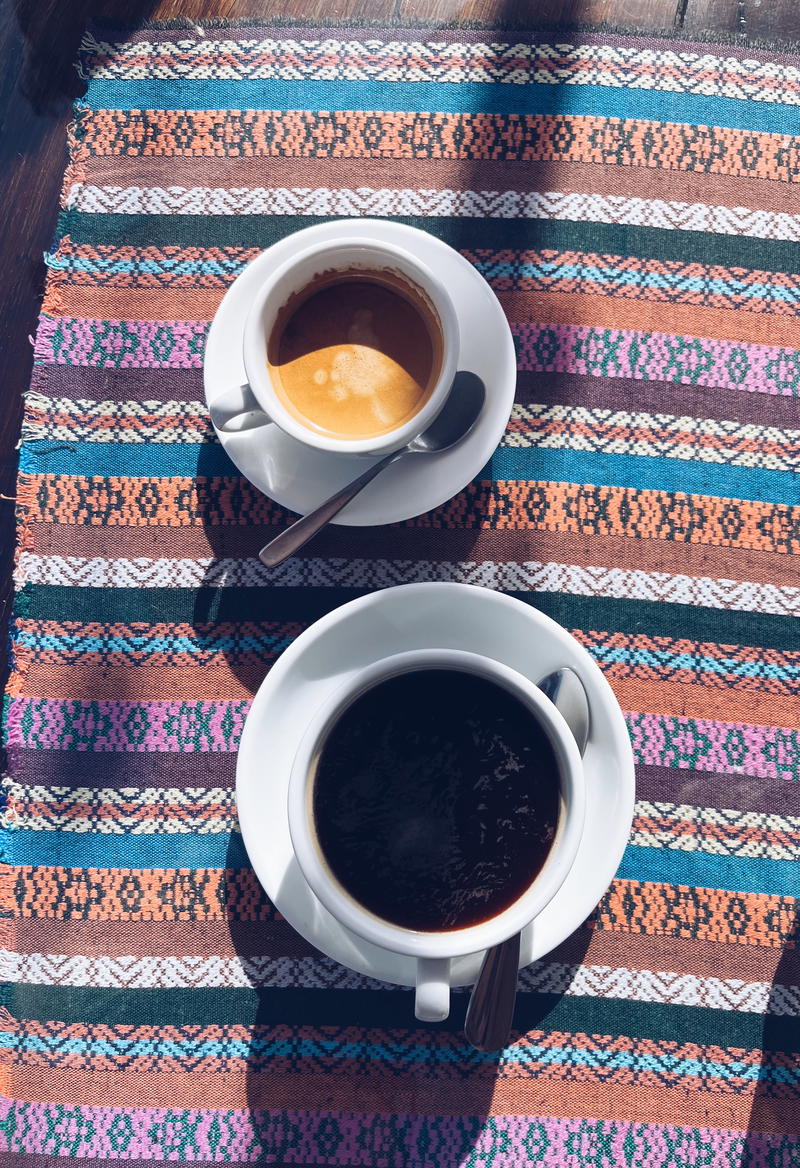 Two cups of coffee from Guatemala on a table.