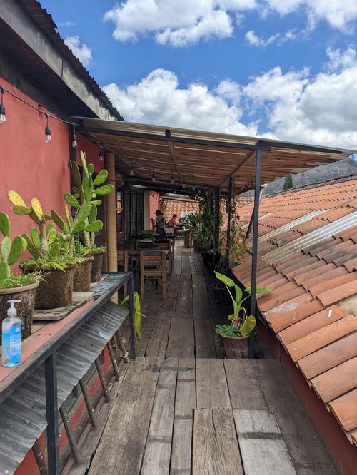 A building in Guatemala with vegetation-covered roof.