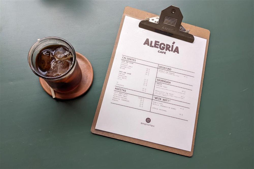 Alegria cafe menu on a clipboard