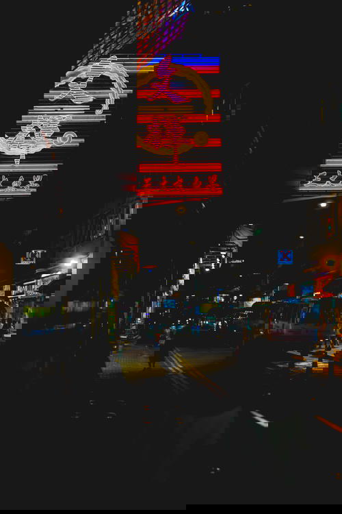 A neon sign in Hong Kong at night.