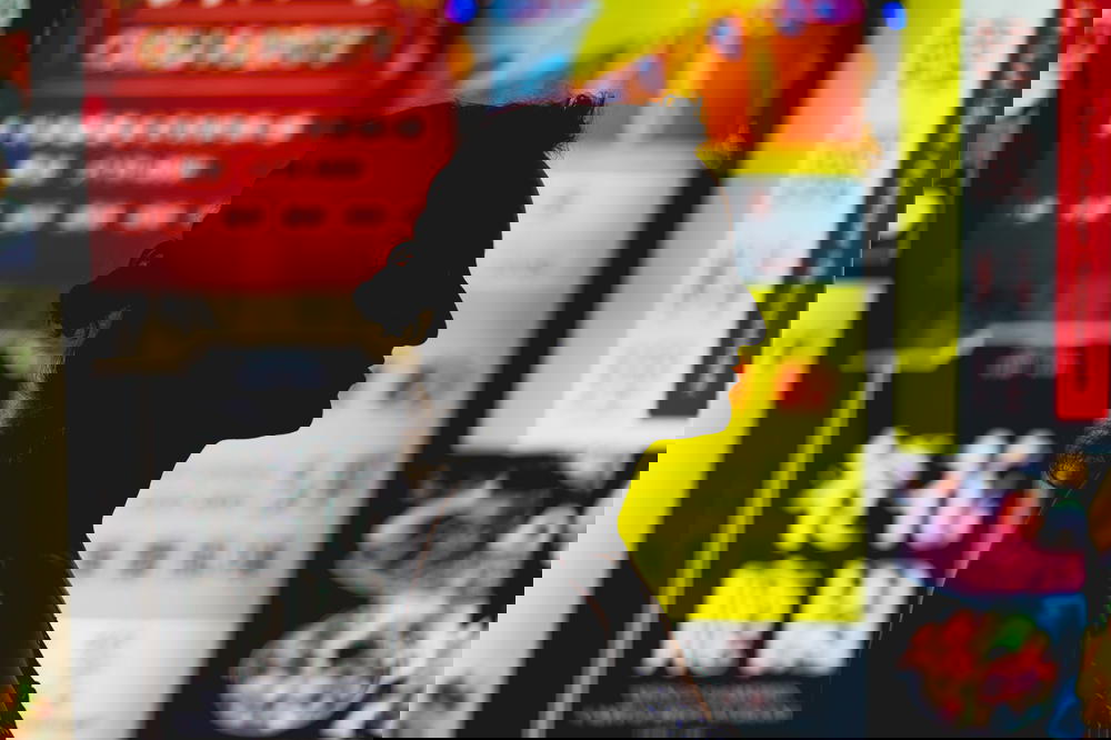 Girl silhouetted by neon signs at night