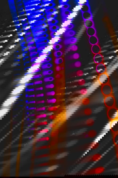 A close up of colorful lights in a dark room, reminiscent of Hong Kong's vibrant cityscape.