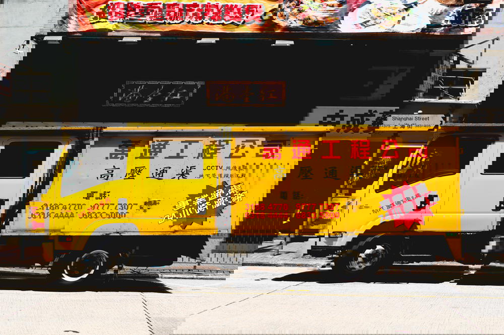 Yellow trash truck in Hong Kong