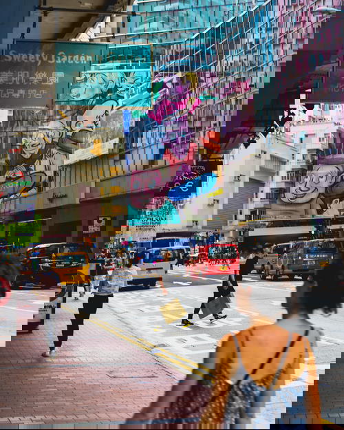 A woman strolling through Hong Kong.