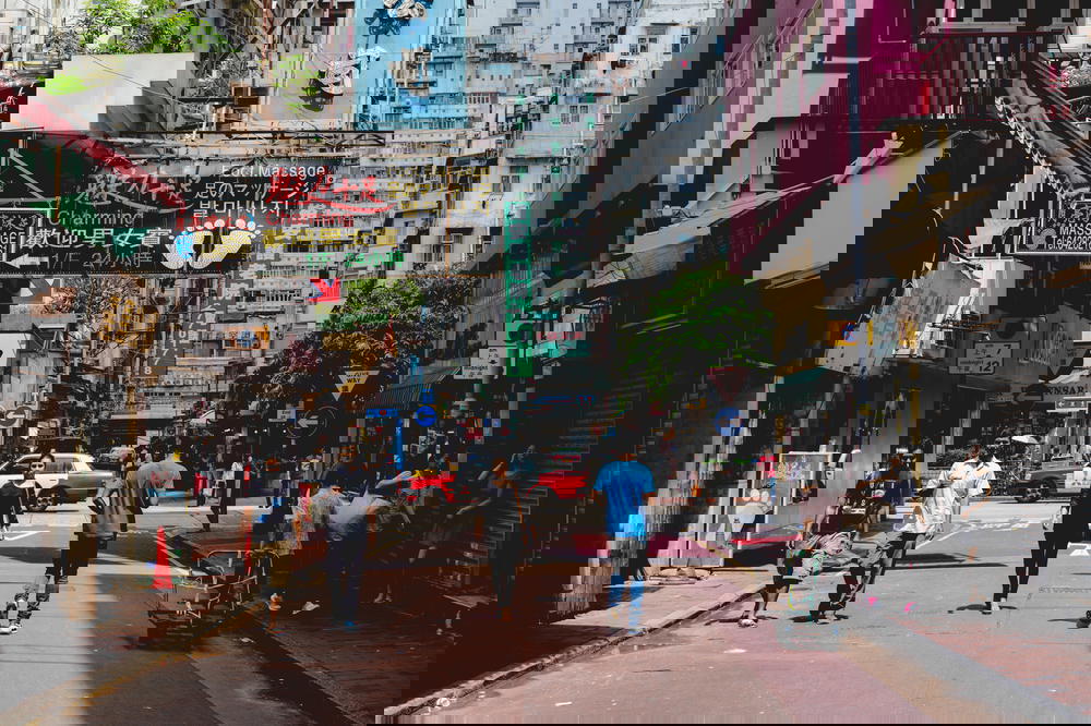 People walking down a street in Hong Kong