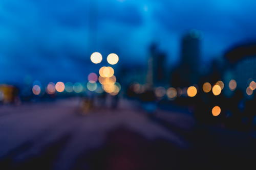 A blurry image of Hong Kong at night.