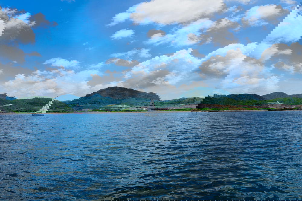Single sail boat in the ocean around Hong Kong