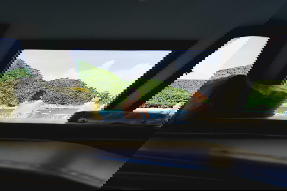 Two girls sitting on the deck of a Hong Kong junk boat