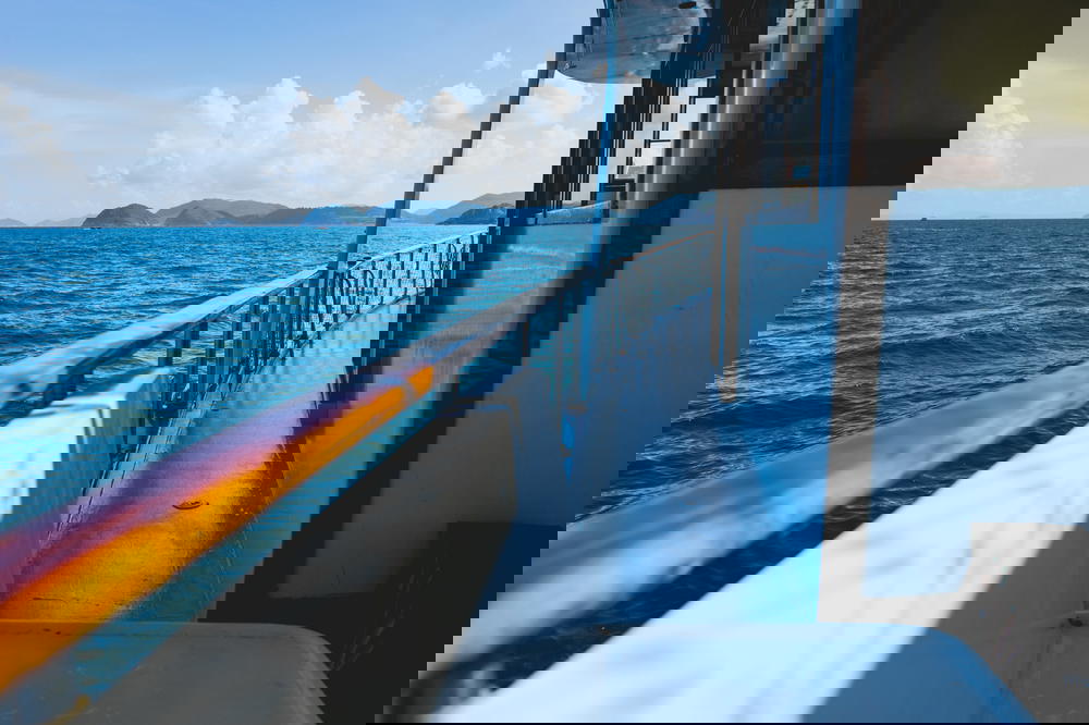 The side of a junk boat with a guard rail