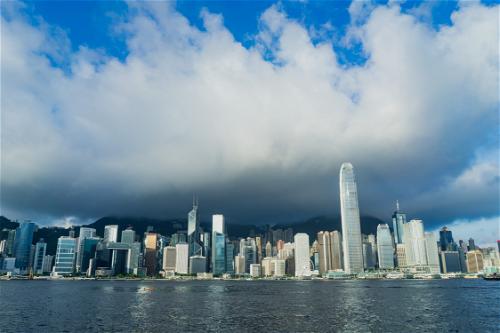 Hong Kong skyline with clouds.