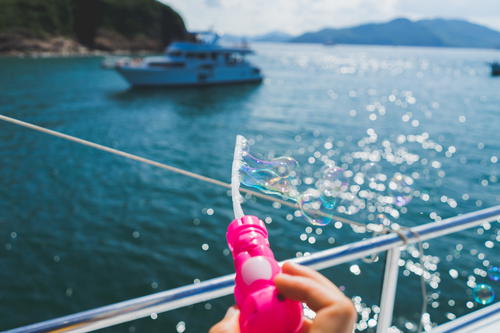 A person blowing bubbles in Hong Kong.