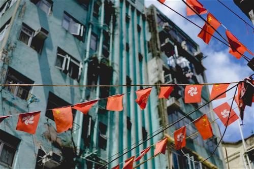 Red and orange flags adorning a Hong Kong building.