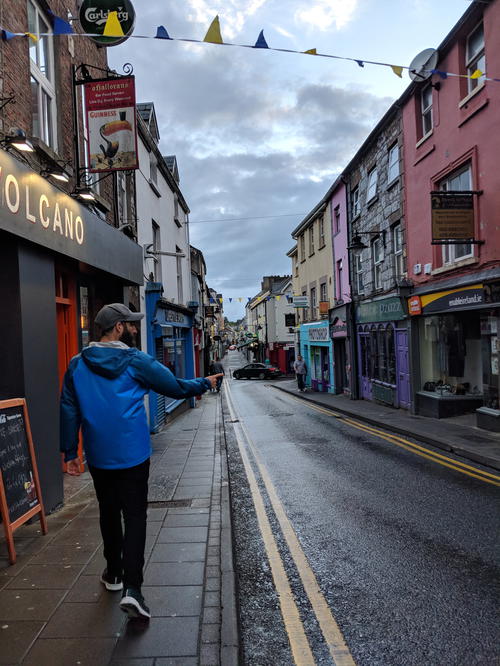 A man flying a kite down the Wild Atlantic Way in Ireland.