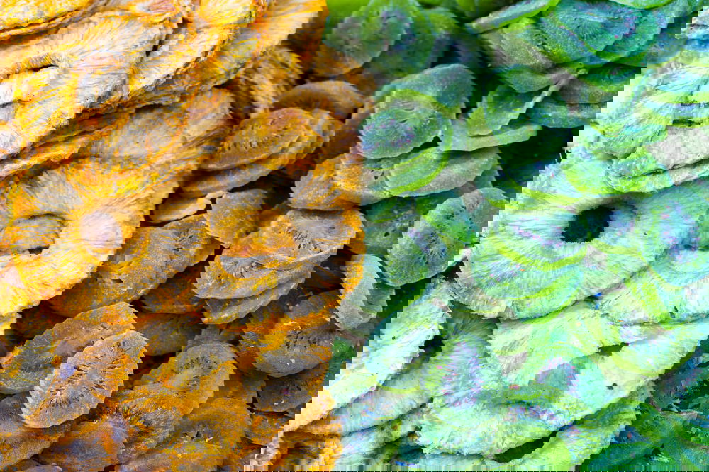 Dried sweet pineapple and dried kiwi fruit vendor shuk carmel tel aviv israel