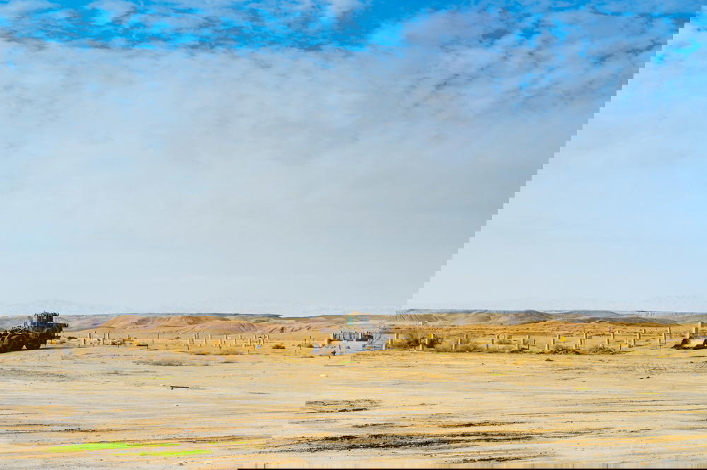 Tractor in a desert scene in the israeli negev desert israel
