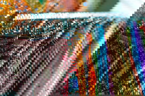 A rack of colorful clothes hanging in Israel.