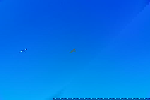 A plane soaring in the clear blue sky above Israel.