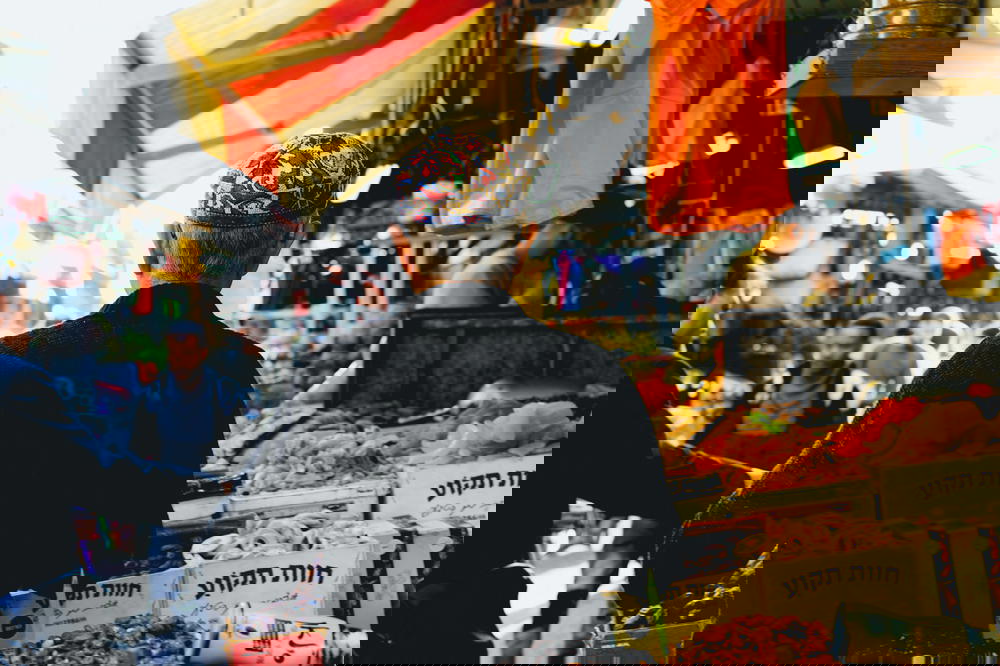 Man wearing a head covering at the central market in Tel Aviv