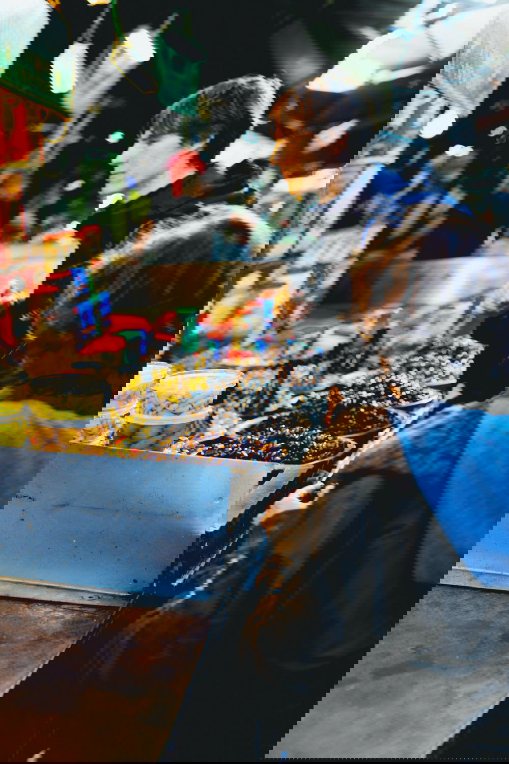 A man and a woman standing at a food stand in Israel.