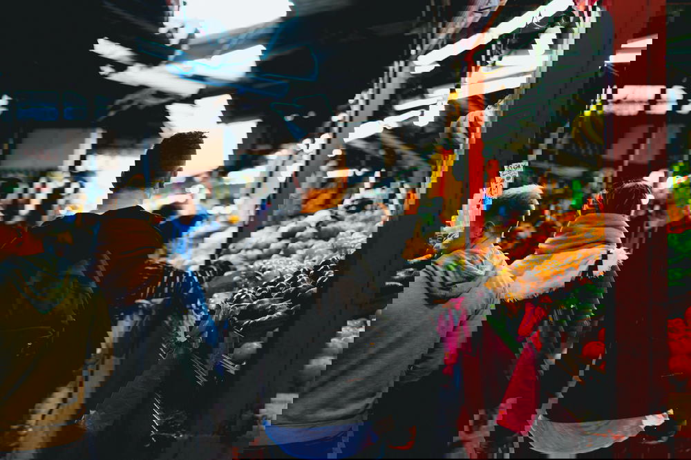 A group of people walking through a market in Israel.