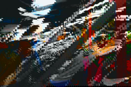 A group of people walking through a market in Israel.