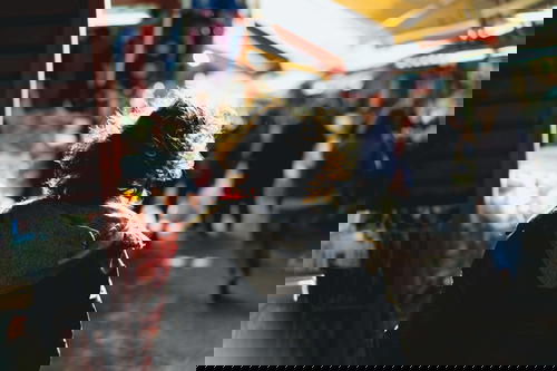 A woman walking down a street in Israel.