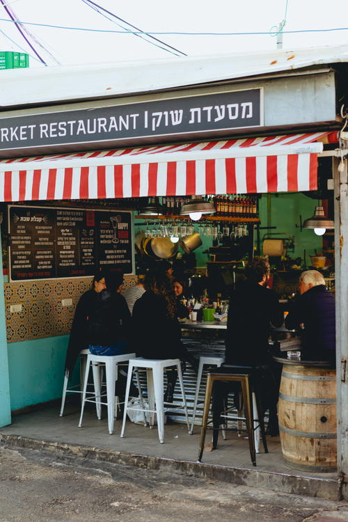 A red and white striped awning in Israel.
