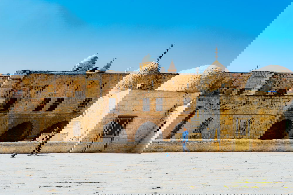 Young Muslim boy playing at the Dome of the Rock in Jerusalem Israel