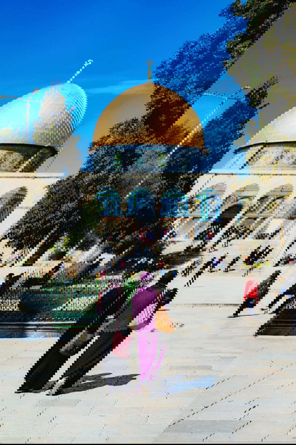 Two Muslim women walking together at the Dome of the Rock in Jerusalem Israel