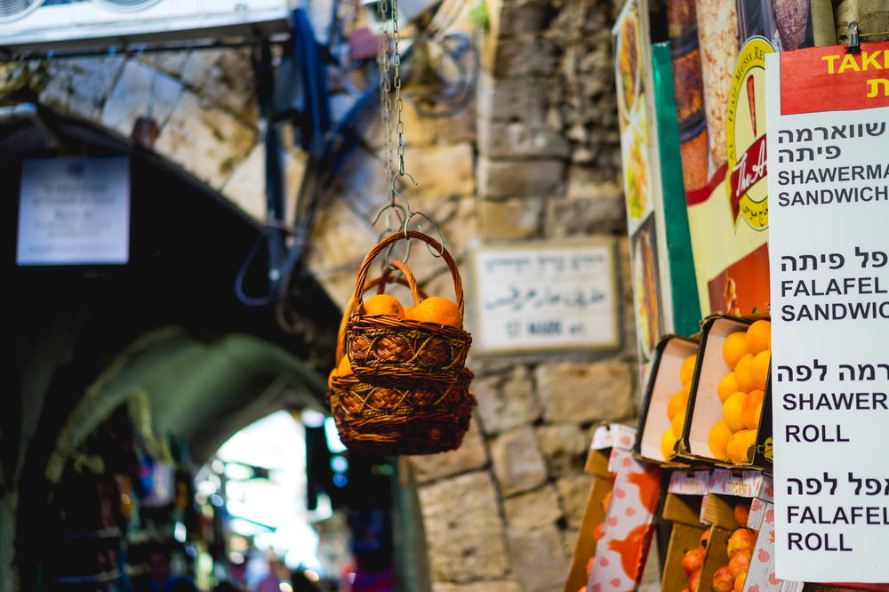 A street in Jerusalem, Israel, adorned with numerous signs.