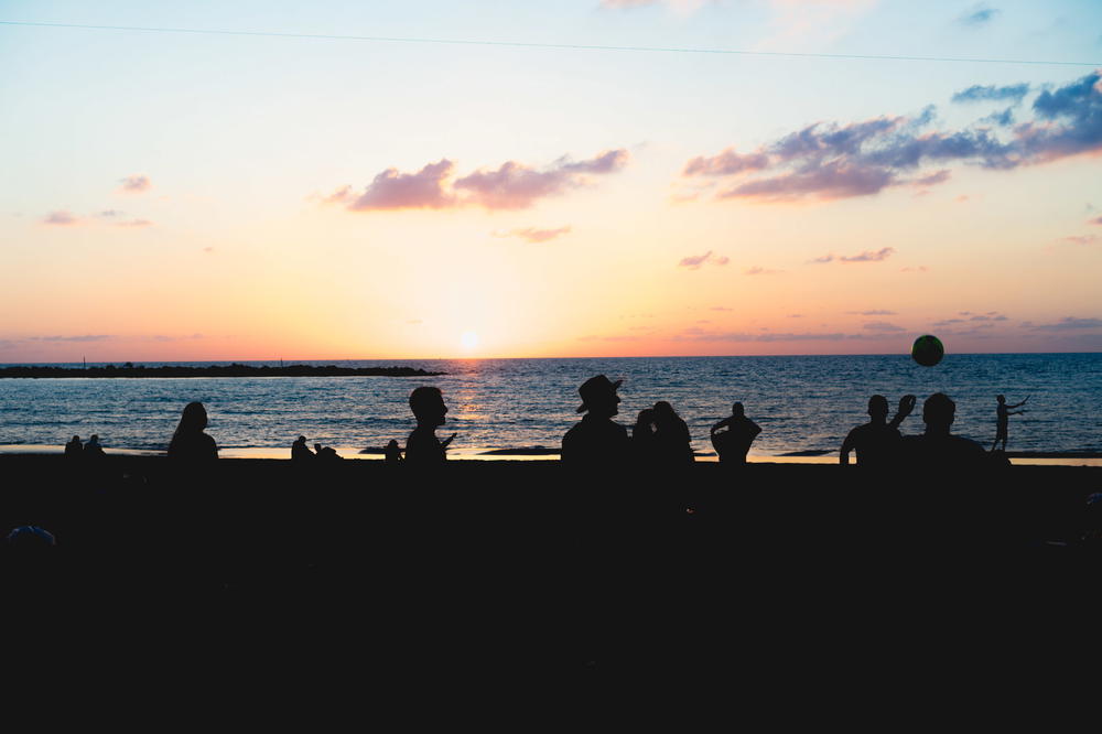 People hanging out at a Tel Aviv beach