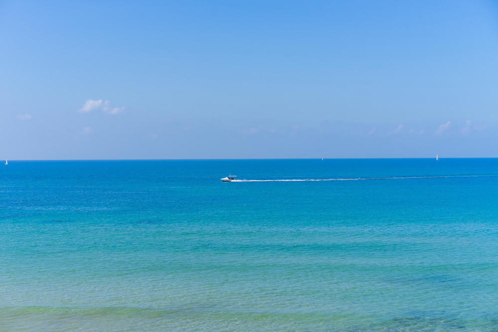 Teal and blue water in the Mediterranean beach in Tel Aviv, Israel