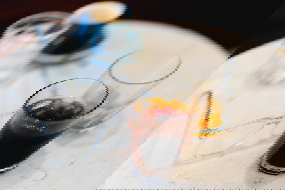 A glass of coffee from Mexico on a table.