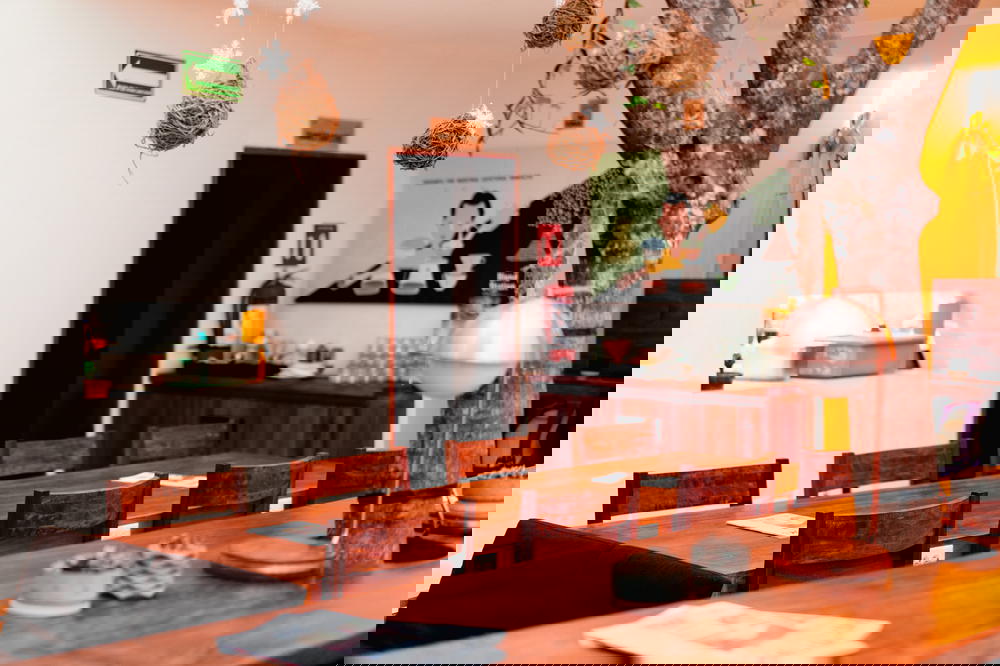 A wooden table and chairs in a Mexican restaurant.