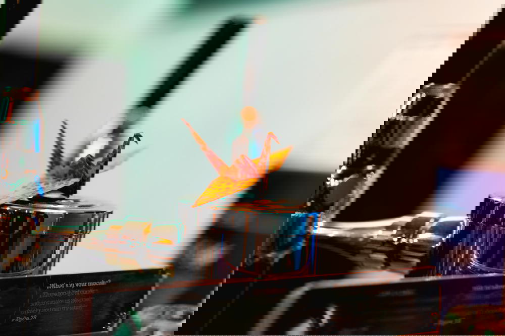 A Mexican-inspired beer tap adorned with a vibrant flower.