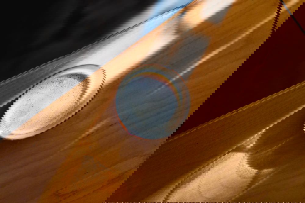 A glass resting on a wooden table in Mexico.