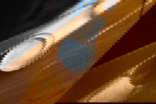 A glass resting on a wooden table in Mexico.