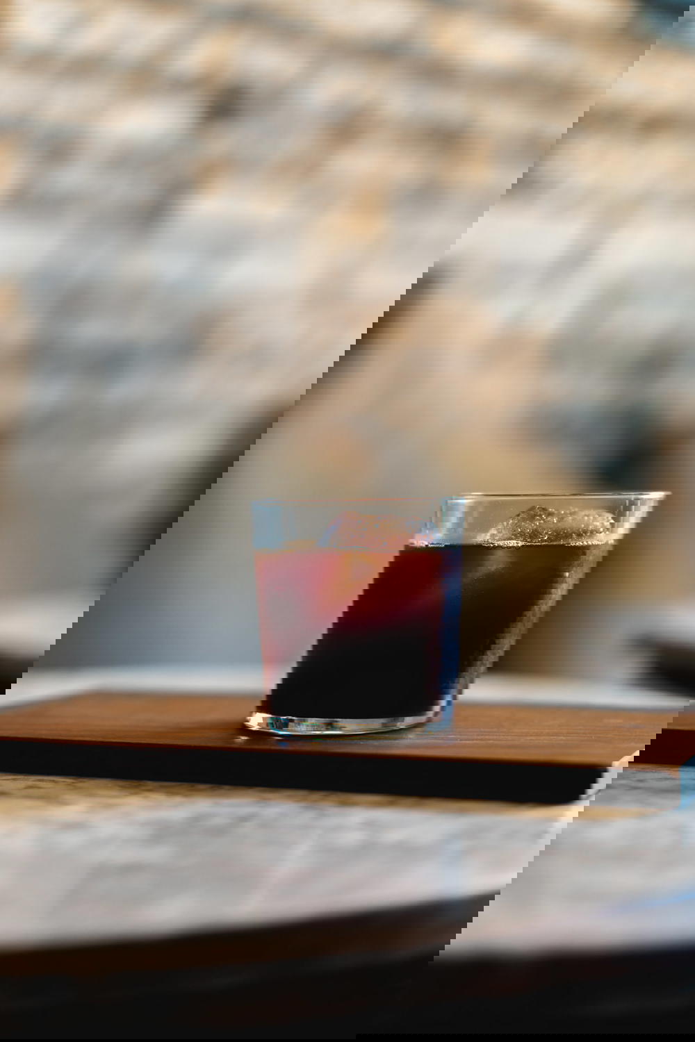 A glass of Mexican coffee on a wooden table.