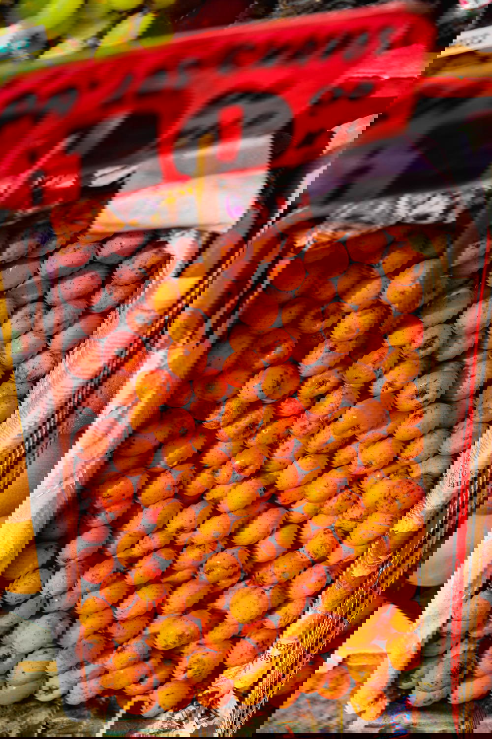 Basket of tiny mandarin citrus fruits for sale from a vendor at a Mexico City market