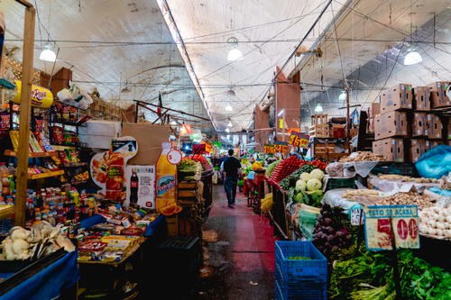 A Mexican market with an abundance of fruit and vegetables.