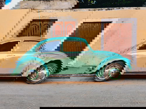 Teal (or light green) 1970s style Volkswagen Beetle