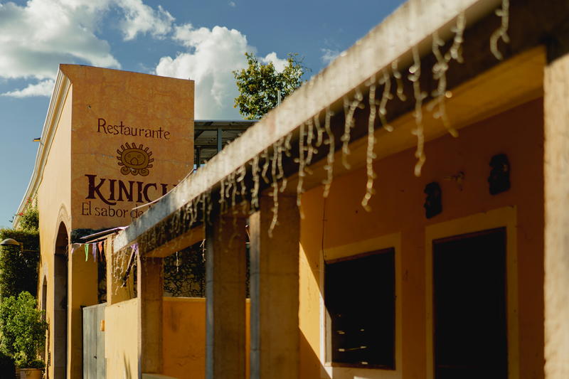 A yellow building in Izamal, Mexico with a sign that says King's Restaurant.