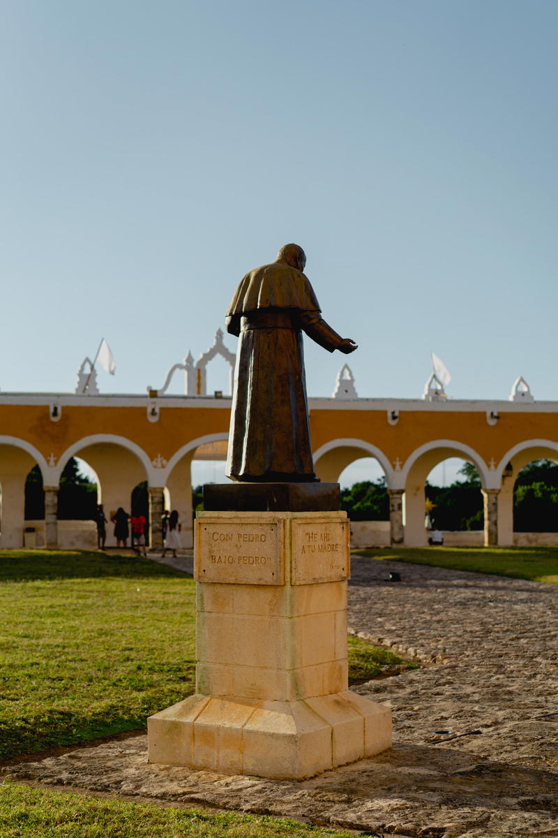 A statue of a man in a park in Izamal, Mexico.