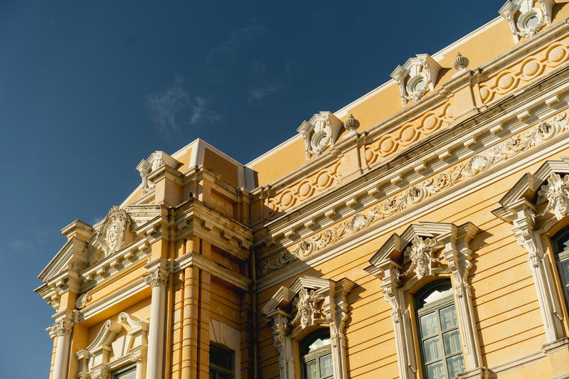 An ornate building with a clock on it in Merida, Mexico.