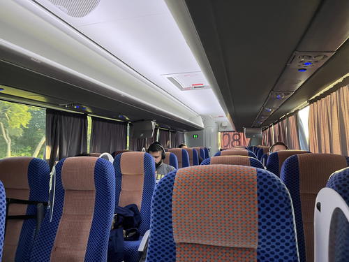A group of people sitting on a bus in Merida, Mexico.